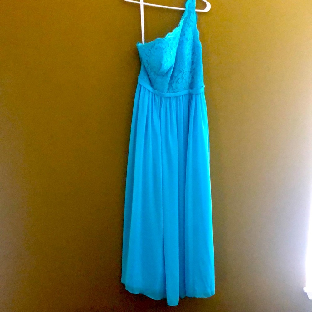 Long blue dress. Worn once. With pockets and side slit. One shoulder.